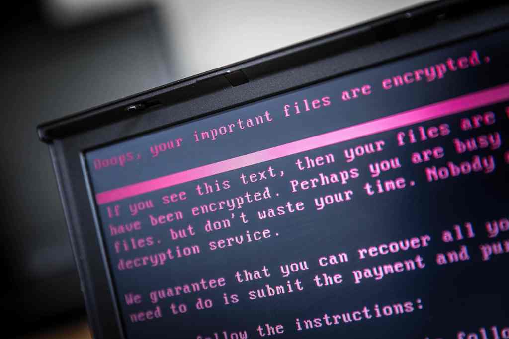 A laptop displays a message after being infected by a ransomware as part of a worldwide cyberattack on June 27, 2017 in Geldrop. Netherlands OUT / AFP / ANP / Rob Engelaar