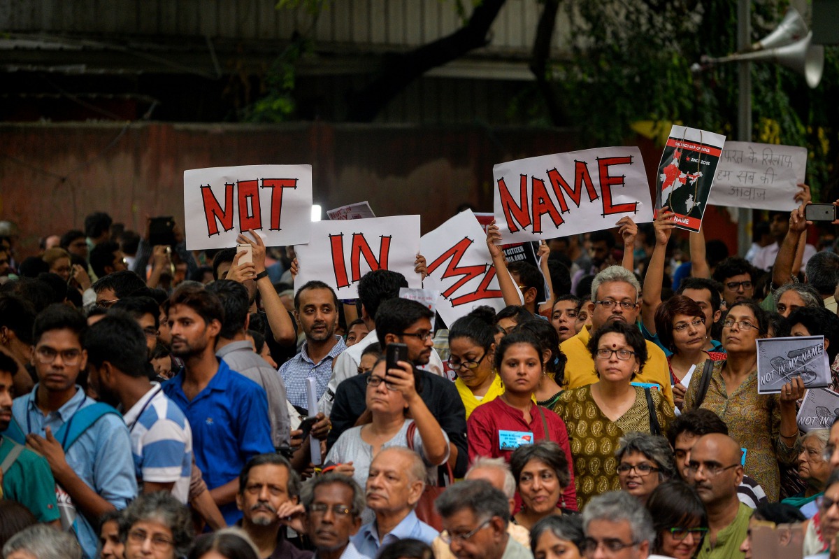 Indian protesters hold placards as they gather during a 'Not in my name' silent protest at Jantar Mantar in New Delhi on June 28, 2017, following a spate anti-Muslim killings. AFP / Chandan Khanna