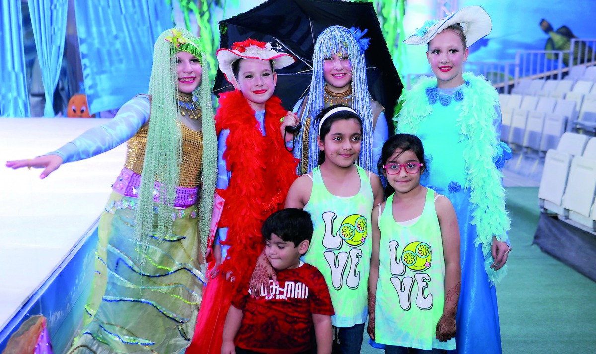 Children with cartoon characters during the Eid celebration at Souq Waqif Al Wakrah. Pic: Abdul Basit / The Peninsula 