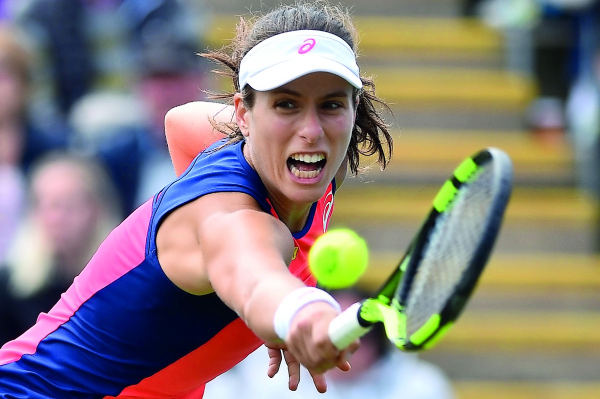 Britain's Johanna Konta plays a shot against Latvia's Jelena Ostapenko during their women's singles third round tennis match at the ATP Aegon International in Eastbourne.