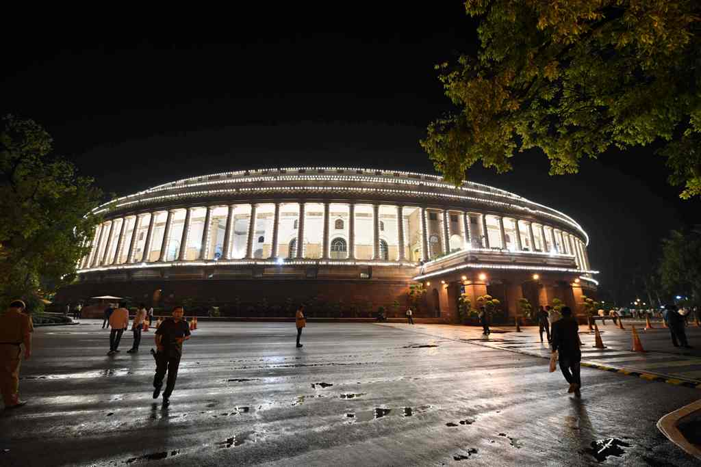 View of the Indian Parliament illuminated prior to a special session for the implementation of the new Goods and Services Tax (GST) regime in New Delhi on June 30, 2017. AFP / PRAKASH SINGH
