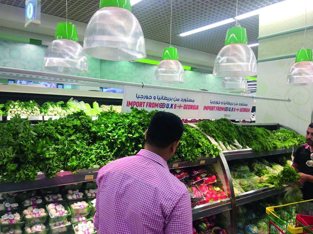People purchasing fruits and vegetables at a shopping mall in Doha yesterday. 