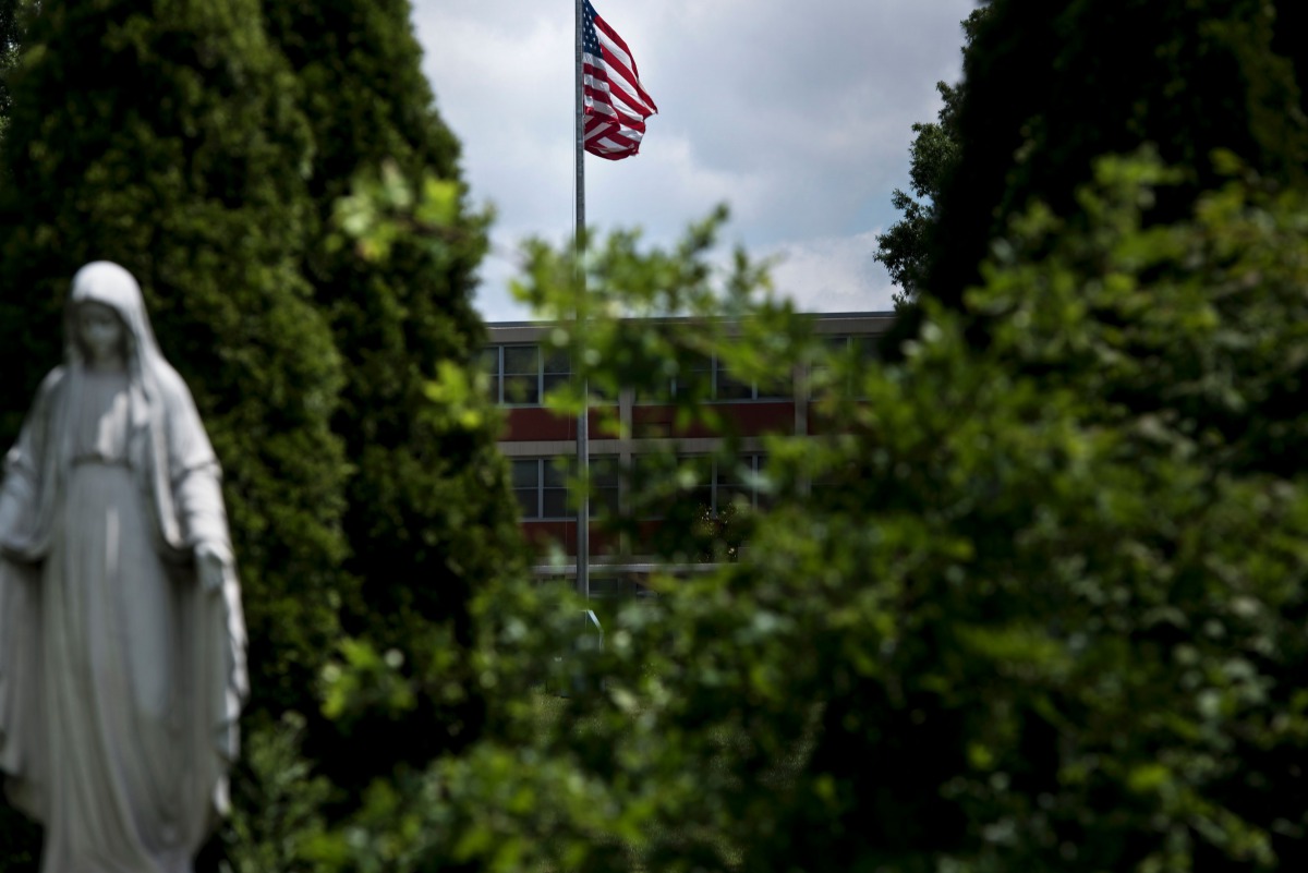 A statue of Mary, Mother of Jesus, in front of Seton Keough High School, formerly Archbishop Keough High School, where Sister Catherine Cesnik worked before her 1969 murder June 23, 2017 in Baltimore, Maryland. 
