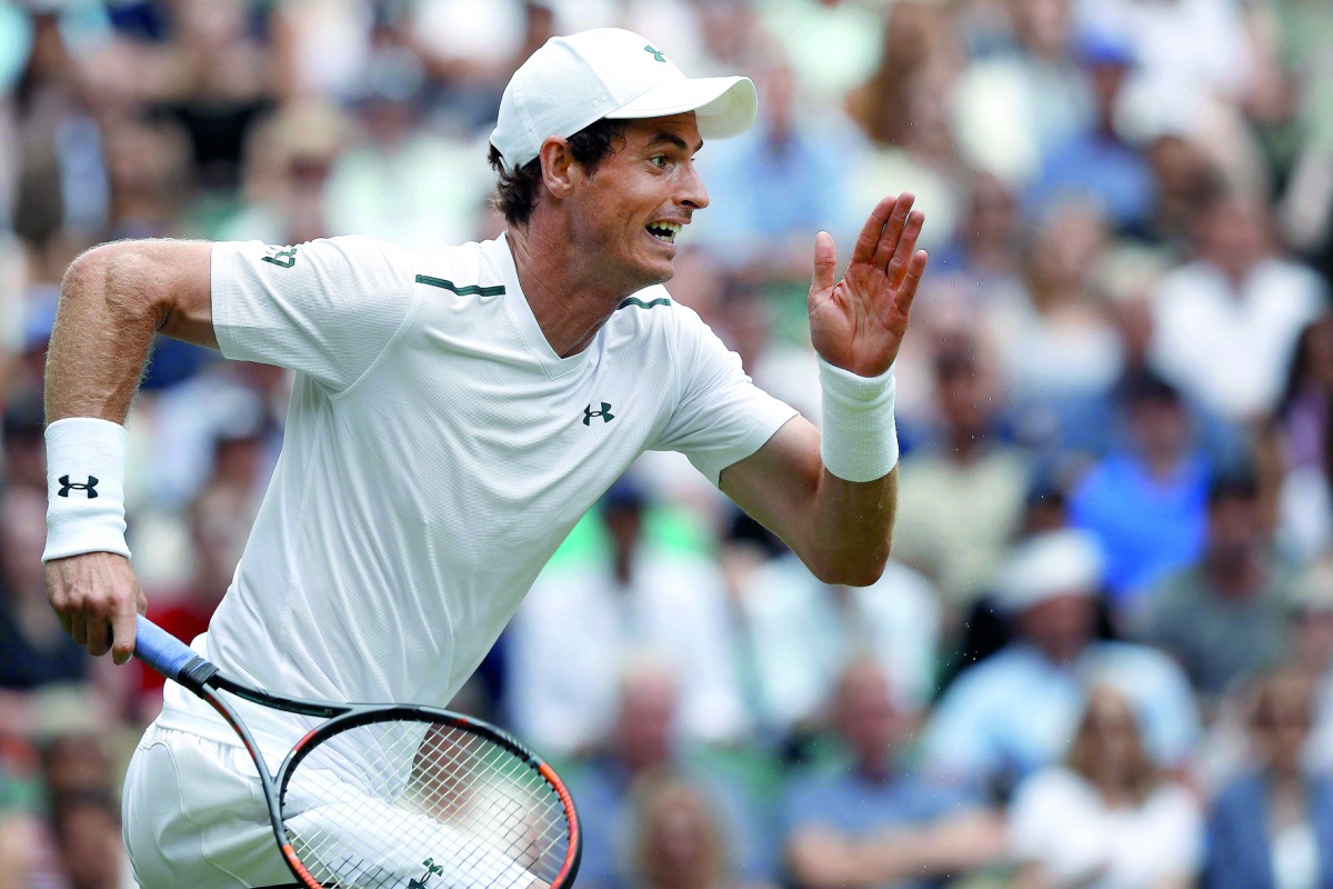 Britain's Andy Murray runs to return to Kazakhstan's Alexander Bublik during their men's singles first round match on the first day of the 2017 Wimbledon Championships yesterday. Murray won the match 6-1, 6-4, 6-2. 