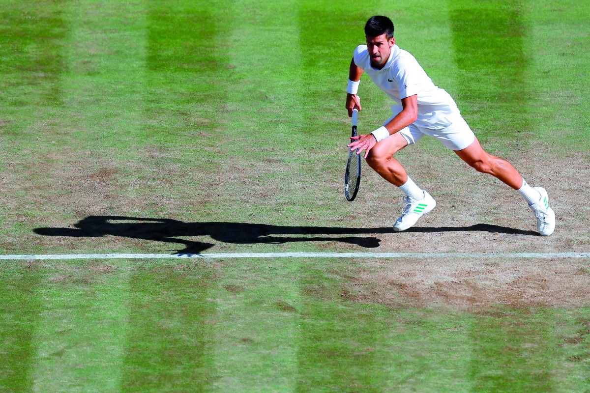 Serbia's Novak Djokovic sets off to hit  a return against Latvia's Ernests Gulbis during their men's singles third round match during the 2017 Wimbledon Championships at The All England Lawn Tennis Club in Wimbledon yesterday.  Djokovic beat Gulbis  6-4, 