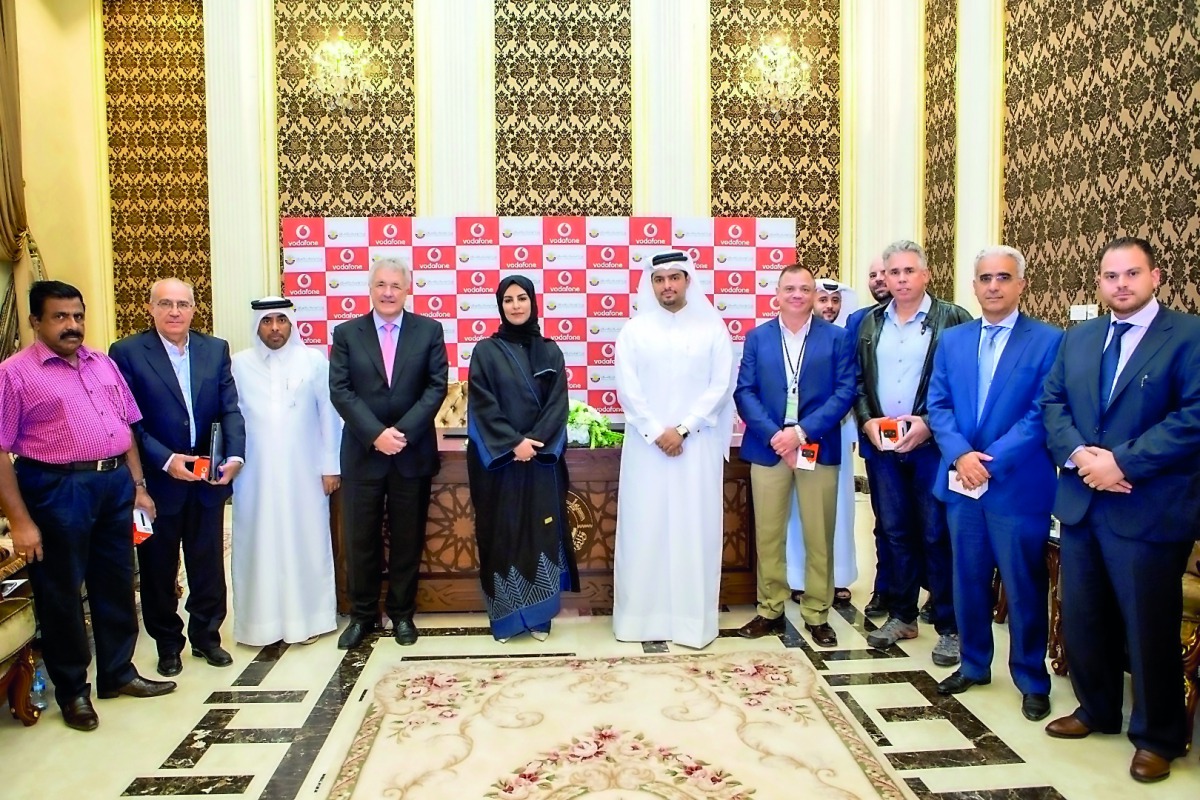 Officials, of MOTC and Vodafone Qatar, during the MoU signing ceremony. 