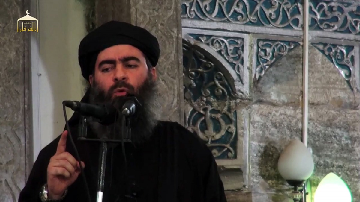 This file grab taken from a propaganda video released on July 5, 2014 by al-Furqan Media allegedly shows the leader of the Islamic State (IS) jihadist group, Abu Bakr al-Baghdadi.  (AFP / AL-FURQAN MEDIA)
