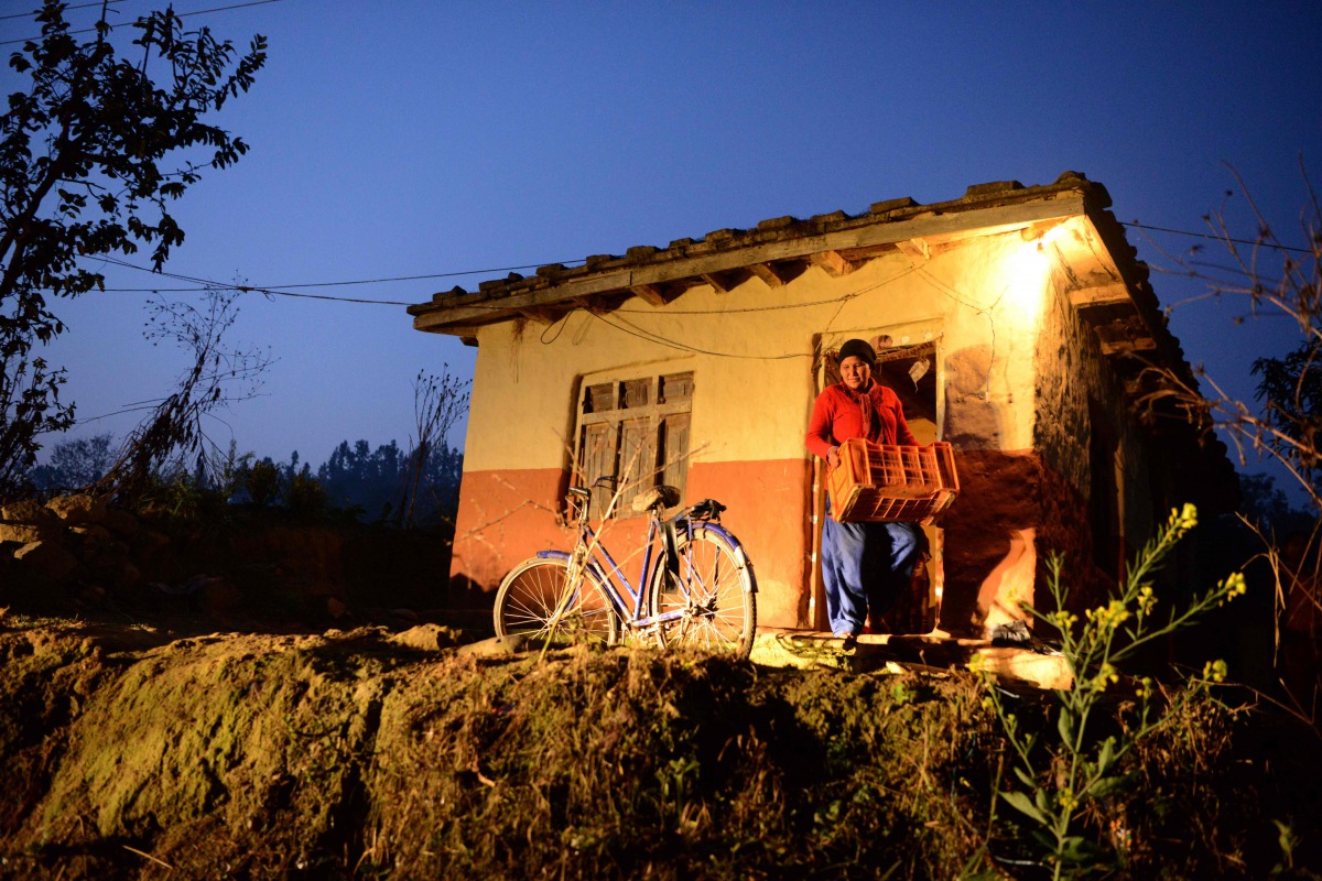 In this photograph taken on February 2, 2017 vegetable vendor Nandukula Basnet, 33, prepares to leave in the early morning for the market in Birendranagar, some 520km west of Kathmandu (AFP / Prakash Mathema) 