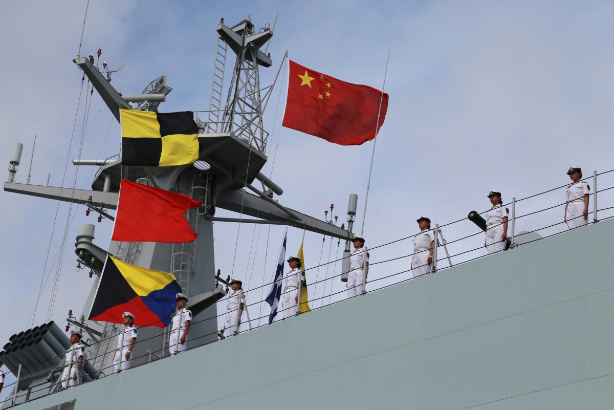 Soldiers of China's People's Liberation Army (PLA) stand on a ship sailing off from a military port in Zhanjiang, Guangdong province, July 11, 2017. (REUTERS)