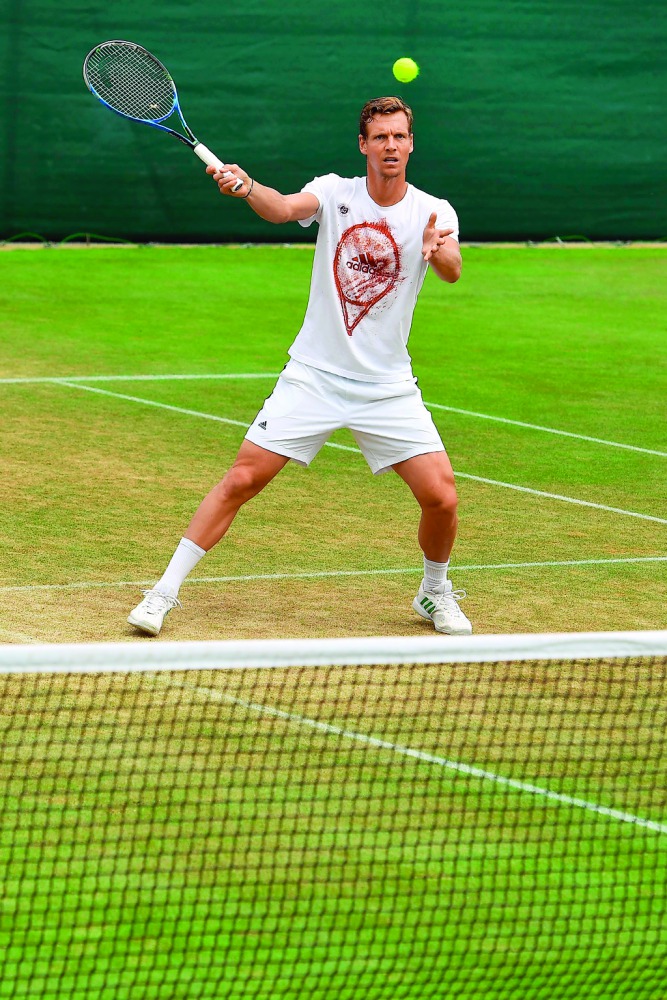 Czech Republic's Tomas Berdych plays a shot as he attends a practice session yesterday, on the eve of his Wimbledon semi-final match against Switzerland's Roger Federer in London.