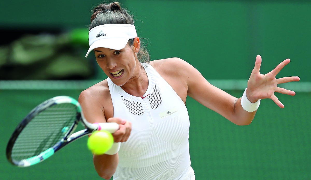 Spain's Garbine Muguruza returns against Slovakia Magdalena Rybarikova during their women's singles semi-final match of the 2017 Wimbledon Championships at The All England Lawn Tennis Club in Wimbledon, southwest London. 