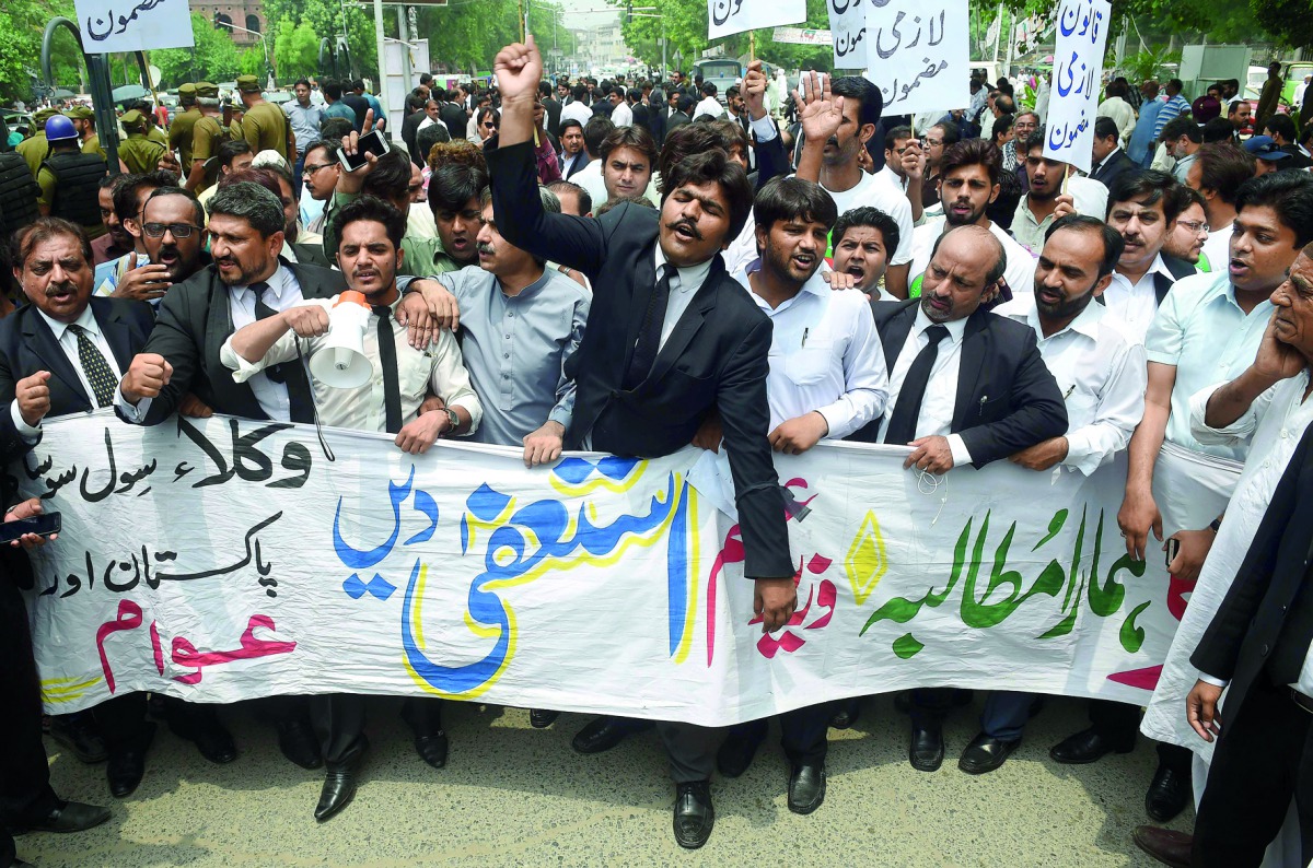 Lawyers shout slogans during a protest against Prime Minister Nawaz Sharif, in Lahore, yesterday.