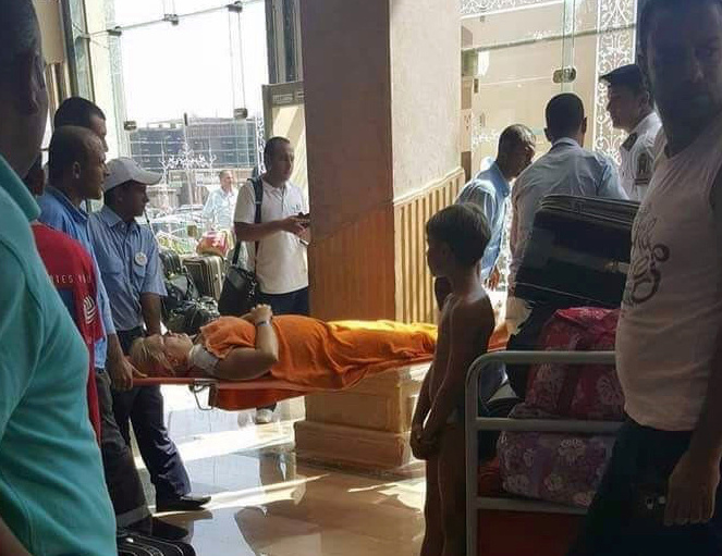 Medics rush an injured tourist at the Zahabia hotel resort, after an Egyptian man stabbed two German tourists to death and wounded four others in Hurghada, south of the capital Cairo, Egypt, July 14, 2017. REUTERS/Mohamed Aly