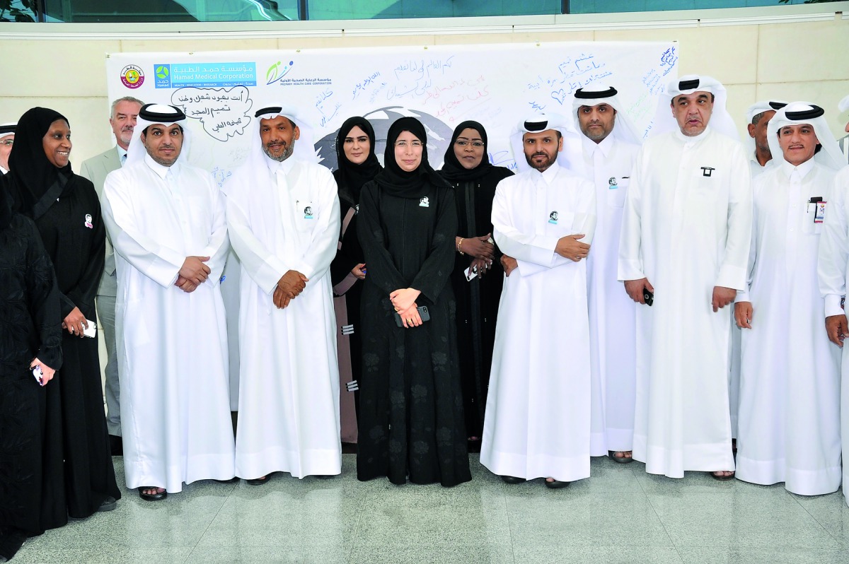Minister of Public Health H E Dr Hanan Mohamed Al Kuwari with officials of HMC and PHCC during the launch of ‘Tamim Al Majd’ images. 