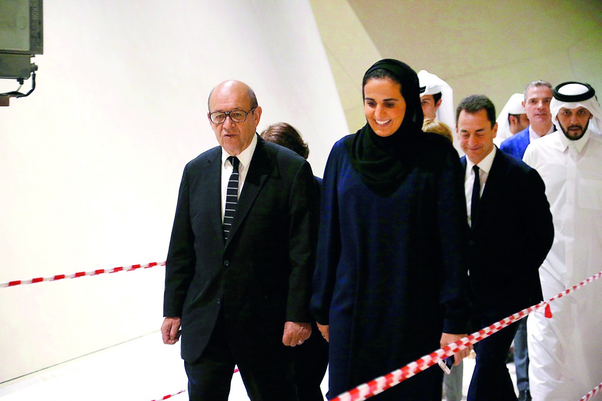 H E Sheikha Al Mayassa bint Hamad bin Khalifa Al Thani, Chairperson of Qatar Museums, and French Foreign Minister Jean-Yves Le Drian, along with Qatar Museums CEO Mansoor bin Ebrahim El Mahmoud and the French Ambassador to Qatar, Eric Chevalier, on a tour