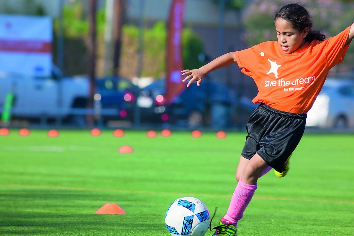 A child playing football as part of an event hosted by ‘Save the Dream’. 