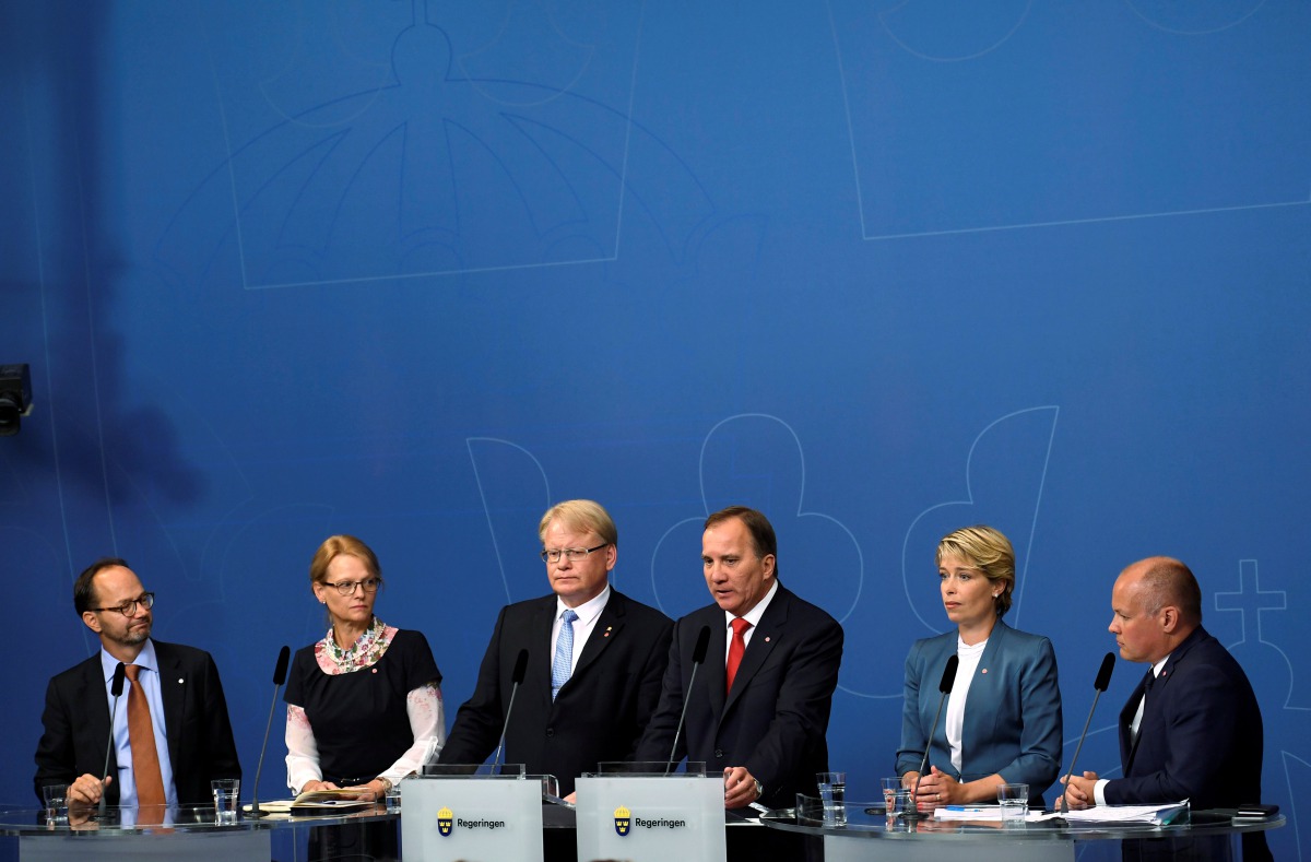 (L-R) Sweden's Infrastructure Minister Thomas Eneroth, Migration Minister Helene Fritzon, Defence Minister Peter Hultqvist, Prime Minister Stefan Lofven, Social Security Minister Annika Strandhall, and Minister for Home Affairs and Justice Morgan Johansso