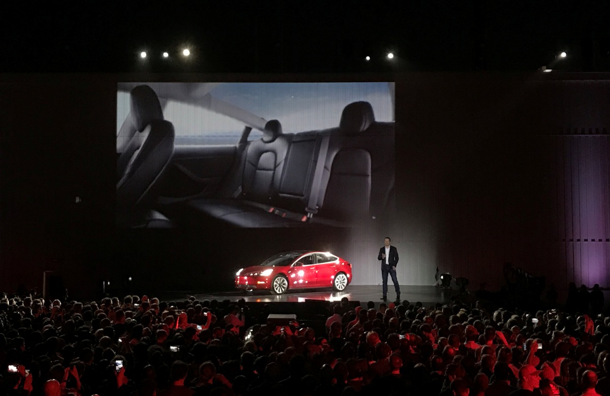 Tesla Chief Executive Elon Musk introduces one of the first Model 3 cars off the Fremont factory's production line during an event at the company's facilities in Fremont, California, US, July 28, 2017. (REUTERS/Alexandria Sage)