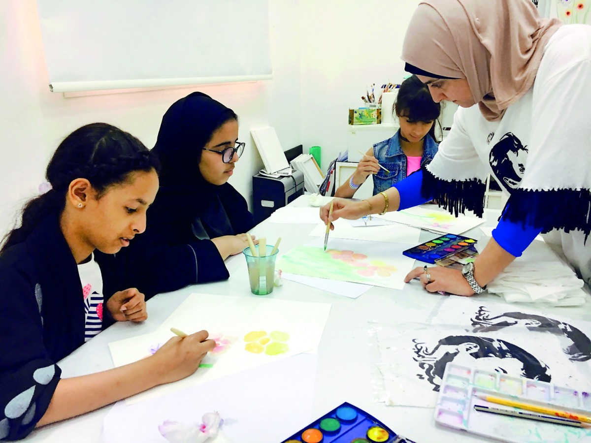 Young girls learning painting at a workshop being held at Girls Creativity Center. Pic: Amna Pervaiz Rao / The Peninsula