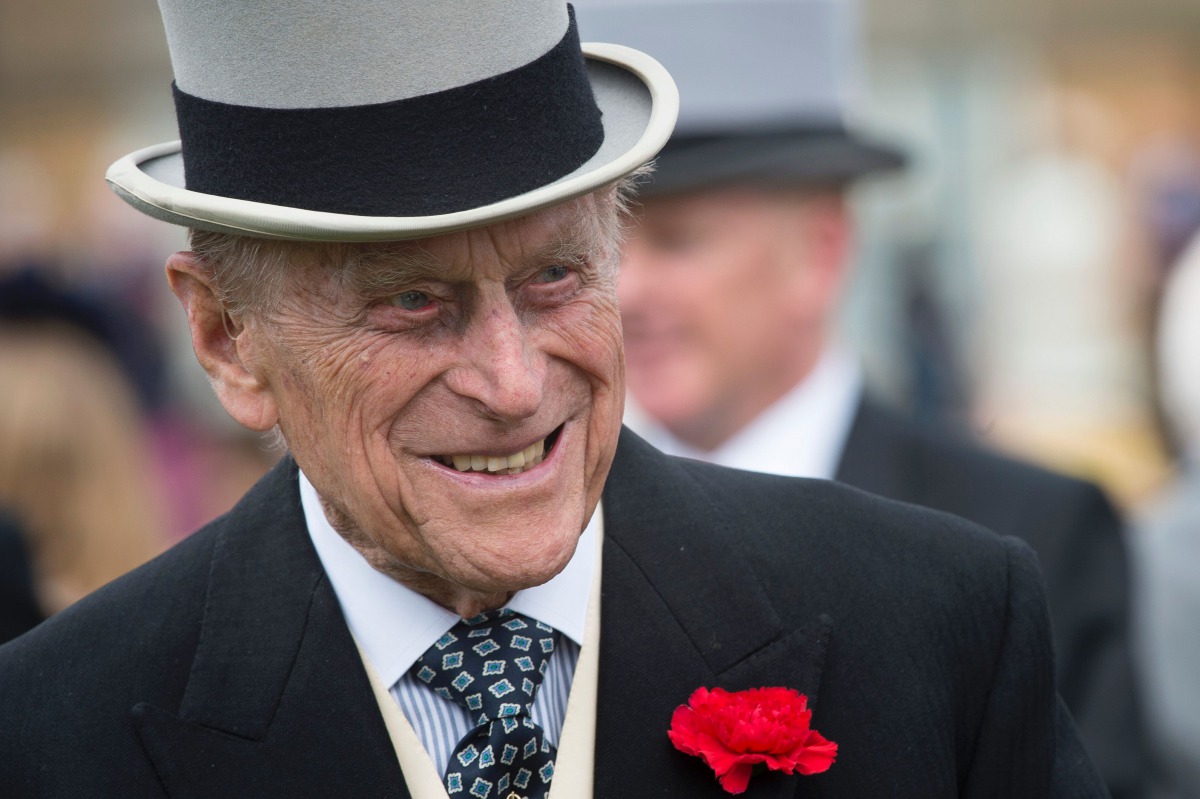 This file photo taken on May 16, 2017 shows Britain's Prince Philip, Duke of Edinburgh greets guests at a garden party at Buckingham Palace in London. (AFP / POOL / Victoria Jones)