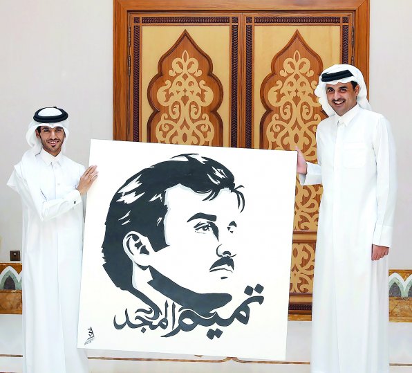 Emir H H Sheikh Tamim bin Hamad Al Thani receiving the original 'Tamim Al Majd' painting from Qatari artist Ahmed Majid Al Ali Al Ma'adid at Al Bahr Palace recently.