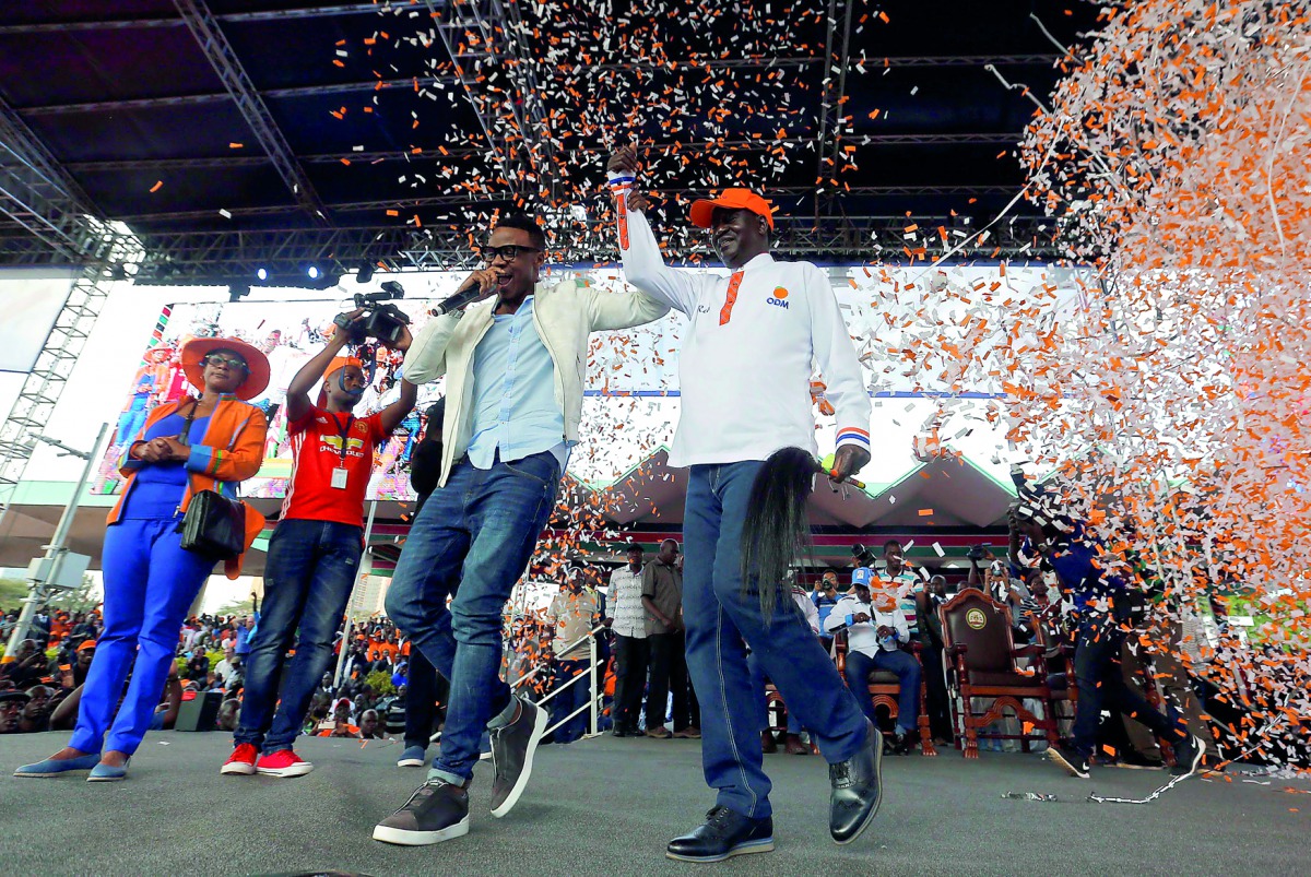 Kenyan opposition leader Raila Odinga, the presidential candidate of the National Super Alliance coalition, participates during their final campaign rally at the Uhuru Park grounds in Nairobi yesterday. 