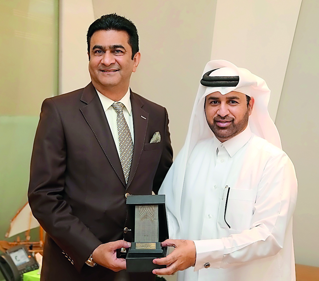 Katara General Manager Dr Khalid bin Ibrahim Al Sulaiti (right) presents a memento to South African Ambassador Shirish Soni at Katara, yesterday.
