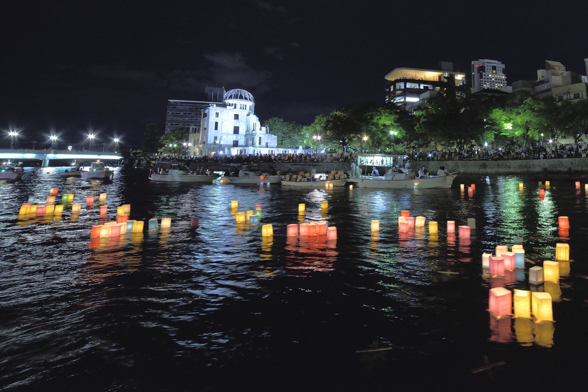 People attend the Peace Message Lantern Floating Ceremony held to console the souls of the A-Bomb victims after the Hiroshima Peace Memorial Ceremony at the Hiroshima Peace Memorial Park on the occasion of the 72nd anniversary of Hiroshima atomic bombing 