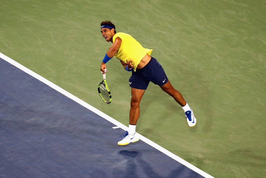 Rafael Nadal of Spain serves to Nick Kyrgios of Australia during Day 7 of the Western and Southern Open at the Linder Family Tennis Center on August 18, 2017 in Mason, Ohio. Rob Carr/Getty Images/AFP
