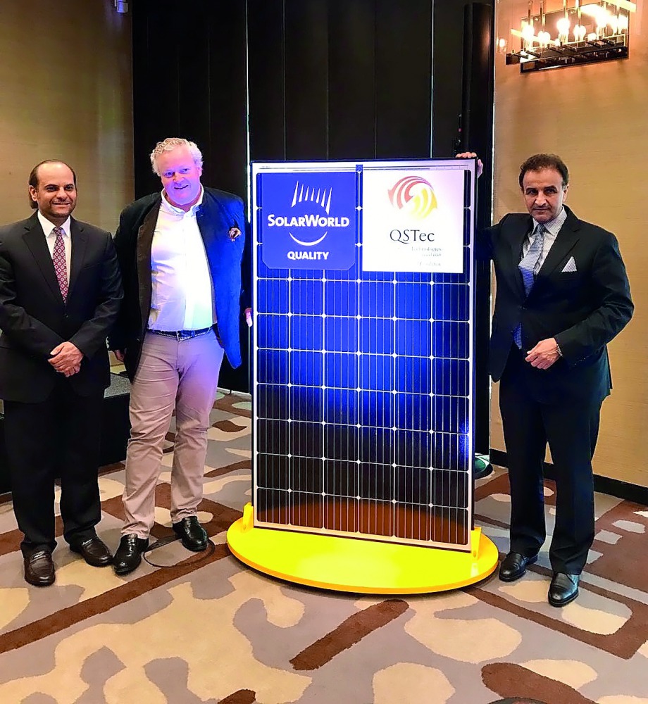 Officials of QSTec and SolarWorld Industries posing for a photo. 