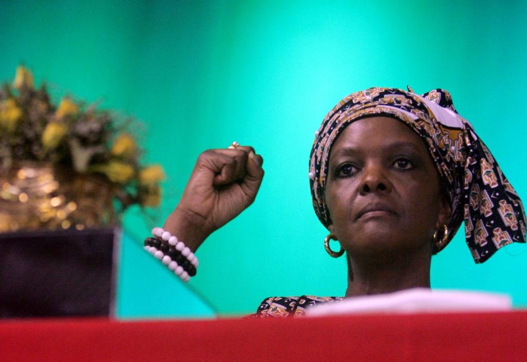 (FILES) This file photo taken on October 8, 2014 shows Zimbabwe's first lady Grace Mugabe raising her fist during a campaign meeting at the City Sports Center in Harare. AFP / Jekesai NJIKIZANA
