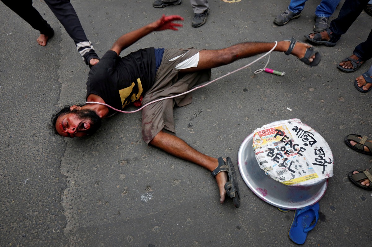 A demonstrator performs in a street play during a protest rally against killings of Rohingya people in Myanmar, near Myanmar consulate in Kolkata, India, September 4, 2017. Reuters/Rupak De Chowdhuri