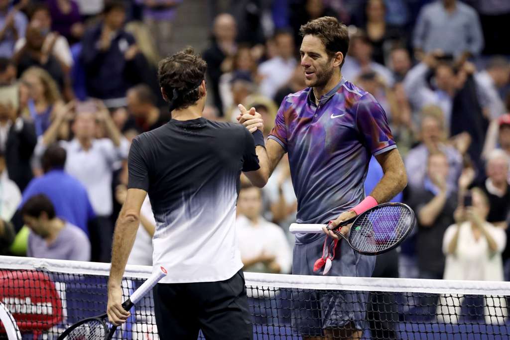 Juan Martin del Potro (R) of Argentina shakes hands with Roger Federer (L) of Switzerland after their Men's Singles Quarterfinal match on Day Ten of the 2017 US Open at the USTA Billie Jean King National Tennis Center on September 6, 2017 in the Flushing 