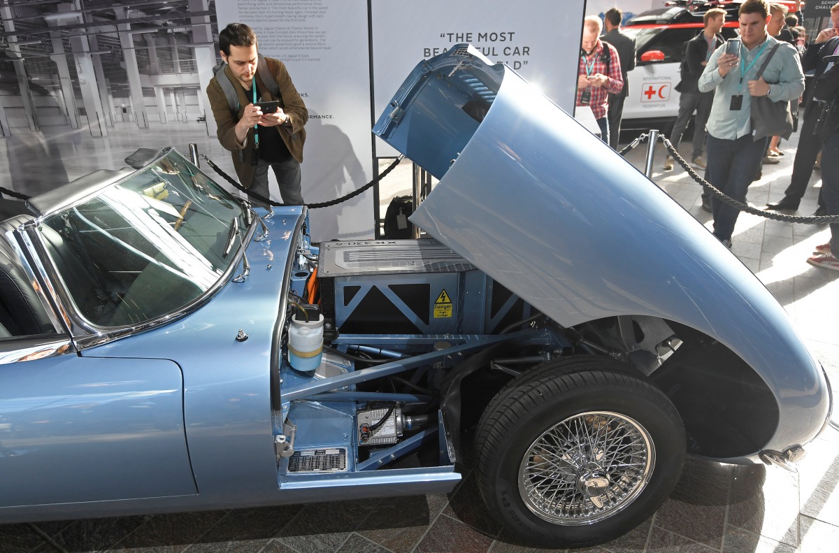 A visitor views a classic Jaguar E-Type modified with an electric engine on display at the Jaguar Land Rover 'Tech Fest' in London, September 7, 2017. REUTERS/Toby Melville