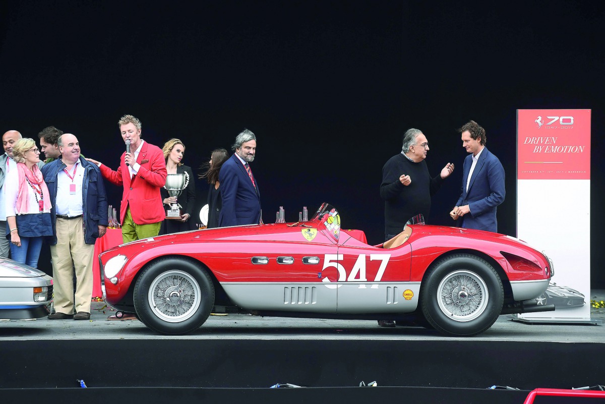 Ferrari’s CEO Sergio Marchionne (second right) and chairman of Fiat Chrysler Automobiles John Elkann (right) are seen during the celebrations of 70th anniversary of the Ferrari brand in Maranello, Italy, yesterday.