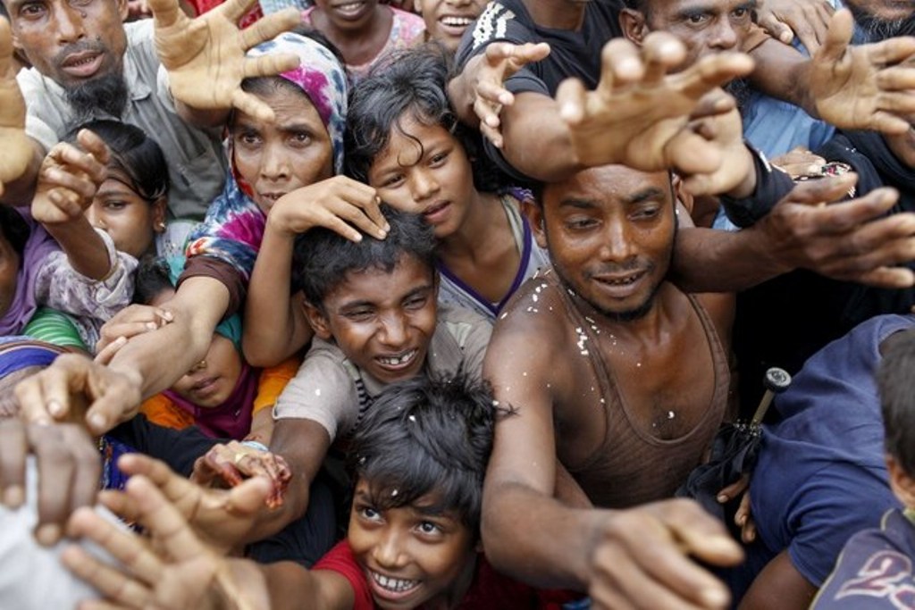 SEEKING AID. Rohingya refugees from Myanmar's Rakhine state wait for aid at Kutupalong refugee camp in the Bangladeshi town of Teknaf on September 5, 2017. K M Asad/AFP.