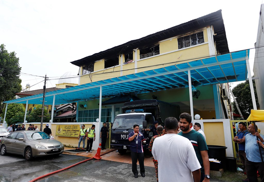 Authorities work at religious school Darul Quran Ittifaqiyah after a fire broke out in Kuala Lumpur, Malaysia September 14, 2017. REUTERS/Lai Seng Sin
