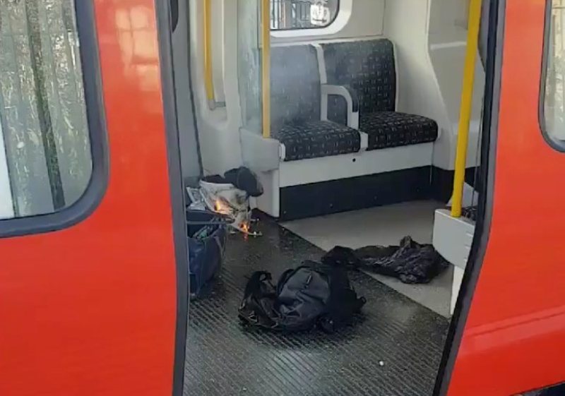 Personal belongings and a bucket with an item on fire inside it, are seen on the floor of an underground train carriage at Parsons Green station in West London, Britain September 15, 2017, in this image taken from social media. SYLVAIN PENNEC/via REUTERS 