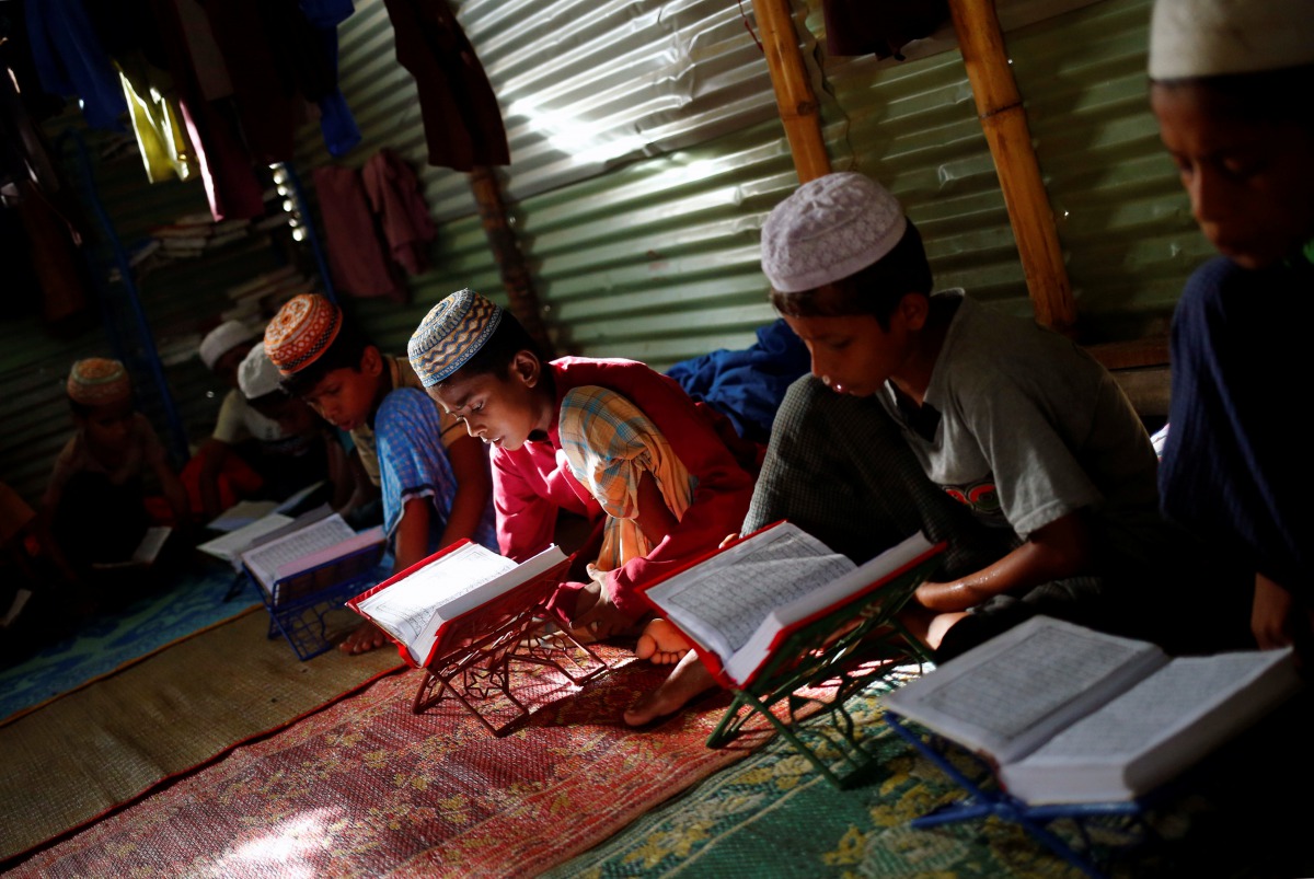 Rohingya refugee boys learn to recite the Quran in an Arabic school in Balukhali Makeshift Camp, in Cox's Bazar, Bangladesh, September 19, 2017. Reuters/Mohammad Ponir Hossain