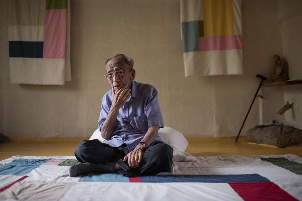 In a photo taken August 22, 2017, former North Korean spy Seo Ok-Ryol sits for an interview in the hokme of a friend in Gwangju. AFP / Ed Jones 