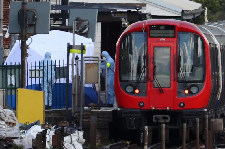 Forensic investigators search on the platform at Parsons Green tube station in London, Britain, September 15, 2017. REUTERS/Hannah McKa