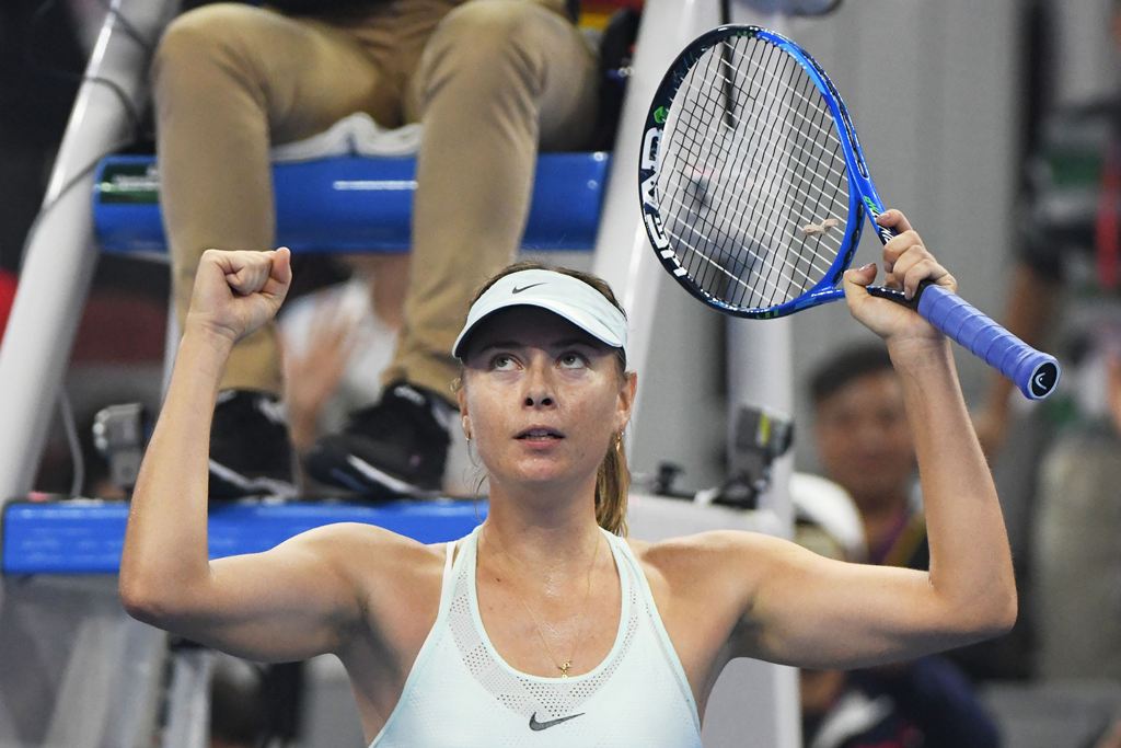 Maria Sharapova of Russia celebrates after winning her match against Anastasija Sevastova of Latvia at the China Open tennis tournament in Beijing on September 30, 2017. (AFP / GREG BAKER)