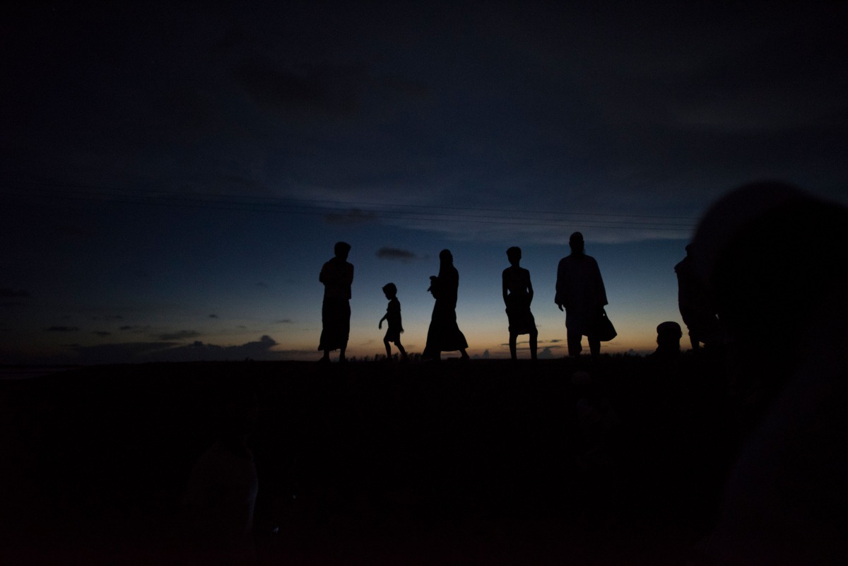 In this picture taken on October 1, 2017, people wait for boats in Teknaf, Bangladesh. AFP / Fred Dufour