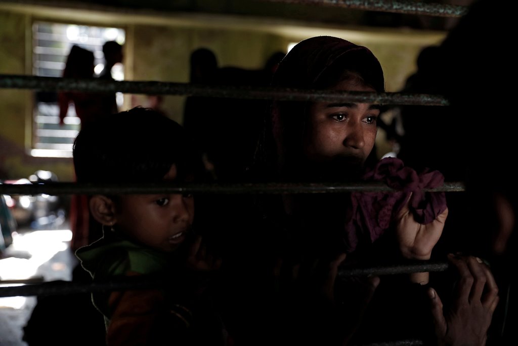 A newly arrived Rohingya refugee waits to be transferred to a camp in Cox's Bazar, Bangladesh, October 2, 2017. REUTERS/Cathal McNaughton 