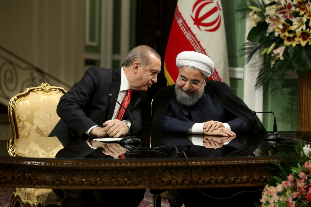 A handout picture provided by the Iranian Presidency shows Iran's President Hassan Rouhani (R) and his Turkish counterpart Recep Tayyip Erdogan attending a press conference in Tehran on October 4, 2017.  AFP / Iranian Presidency