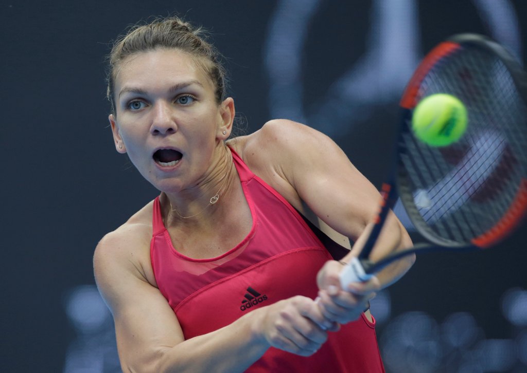 Simona Halep of Romania in action against Jelena Ostapenko of Latvia. REUTERS/Jason Lee
