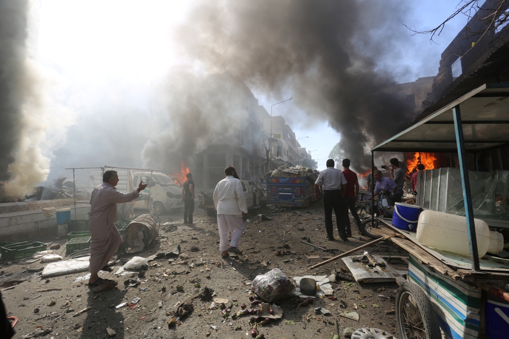 Smoke rises from material caught on fire after an airstrike hit a marketplace in Maarrat al-Nu'man town of Idlib, Syria on October 8, 2017.   Muhammed Karkas - Anadolu Agency 
