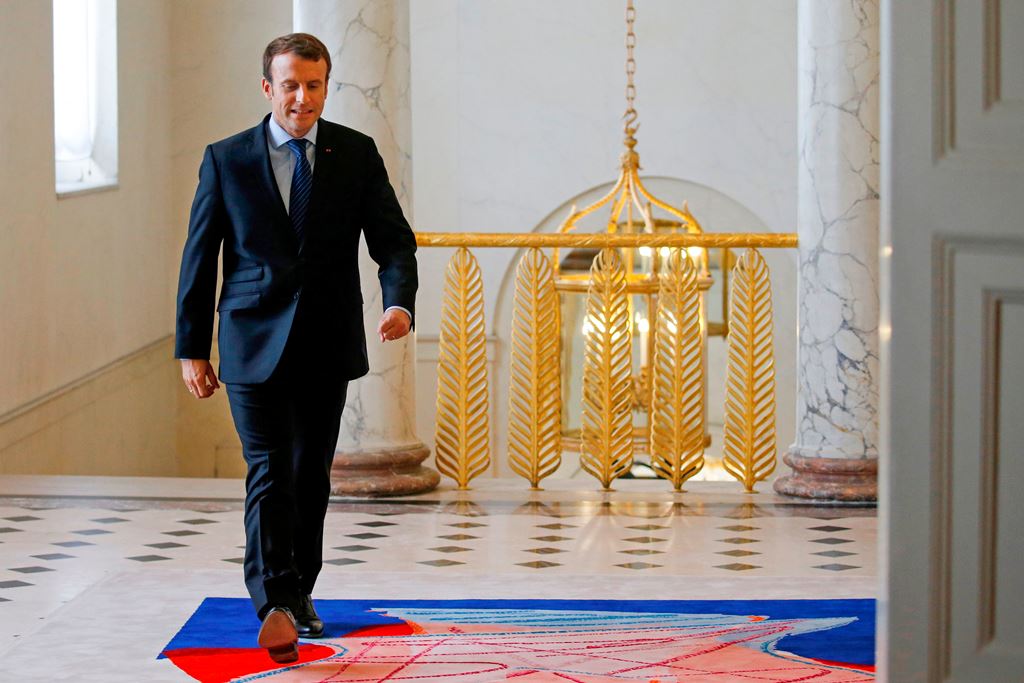 French President Emmanuel Macron arrives for a meeting with French labour unions' representatives on professional training, apprenticeship and universalisation of unemployment insurance as part of the labour law reforms, on October 12, 2017 at the Elysee 