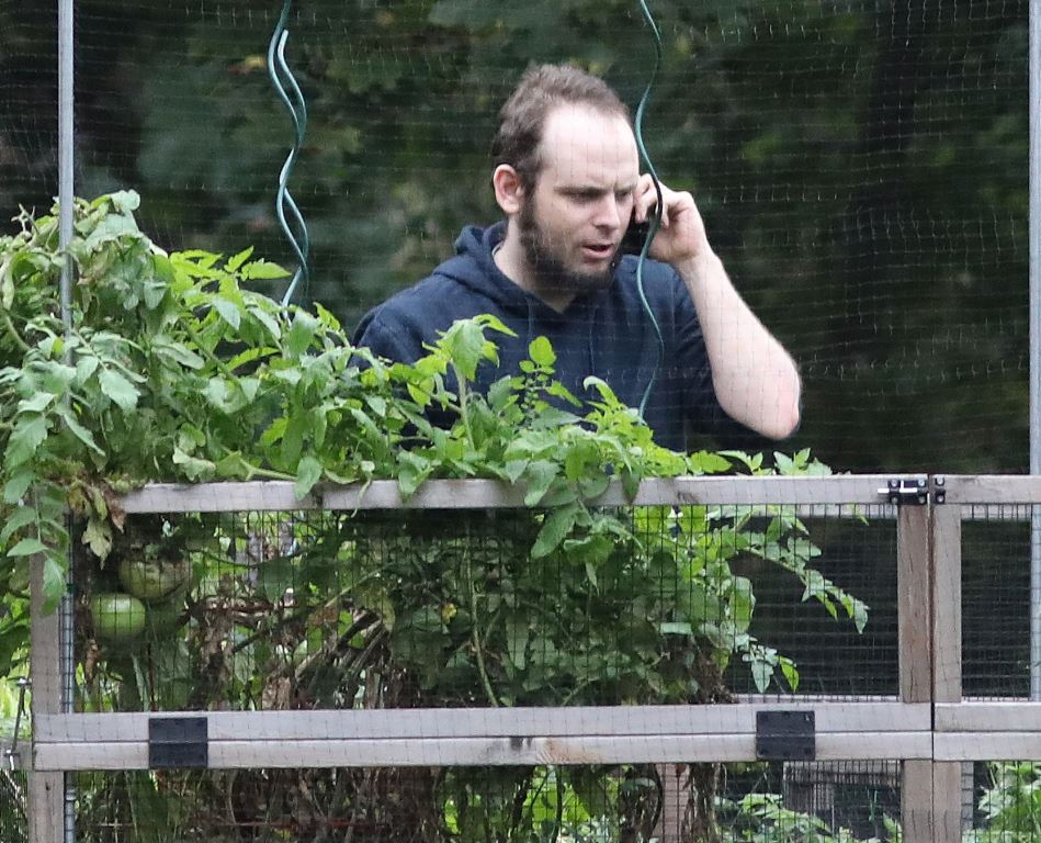 Freed Canadian hostage Joshua Boyle talks on the phone outside the Boyle family home in Smiths Falls, Ontario, Canada, on October 14, 2017. AFP / Mike CARROCCETTO