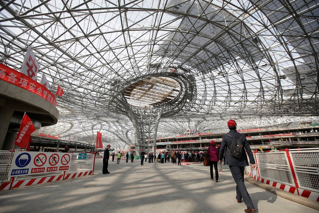 Journalists visit the terminal hall of new Daxing Airport, during a government trip, under construction on the outskirts of Beijing, China October 16, 2017. REUTERS/Jason Lee
